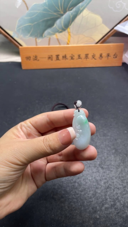 F33832095 Jadeite Ruyi Pendant Total weight approx. 13.4g (including cord weight) Matching beads not jadeite