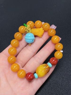 C41930395 琥珀蜜蜡手串 非金 配石考虑非天然 货品总重约20.52克 卡10.9mm左右
