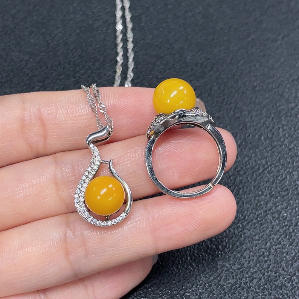 C29368481 Amber Beeswax Pendant + Ring Adjustable Non-Gold Total Weight Approx. 7.72g Sell as a Lot