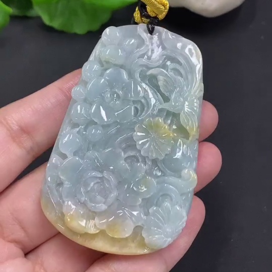 F35163715 Jadeite Flower of Prosperity Pendant with a total weight of approximately 58 grams including the cord