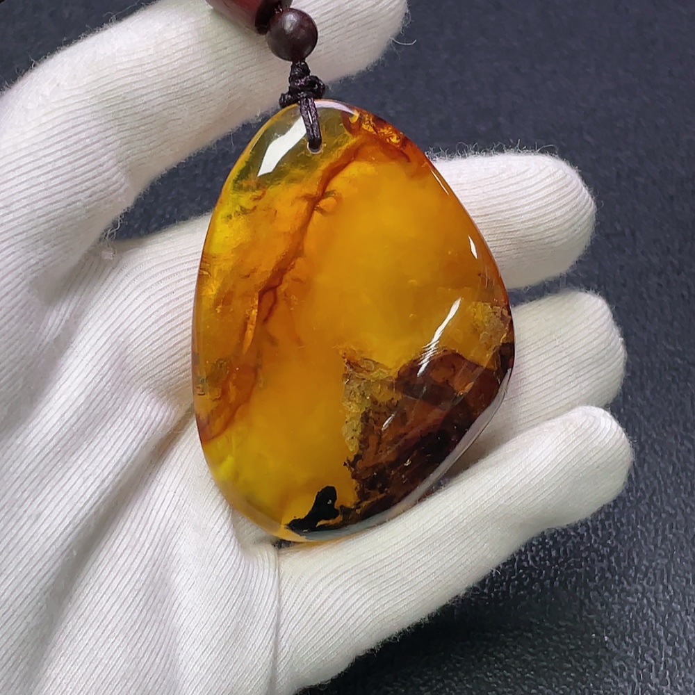C30474274 Amber Beeswax Pendant with Partial Visible Repairs, Total Weight Approx. 16.91g Including Cord