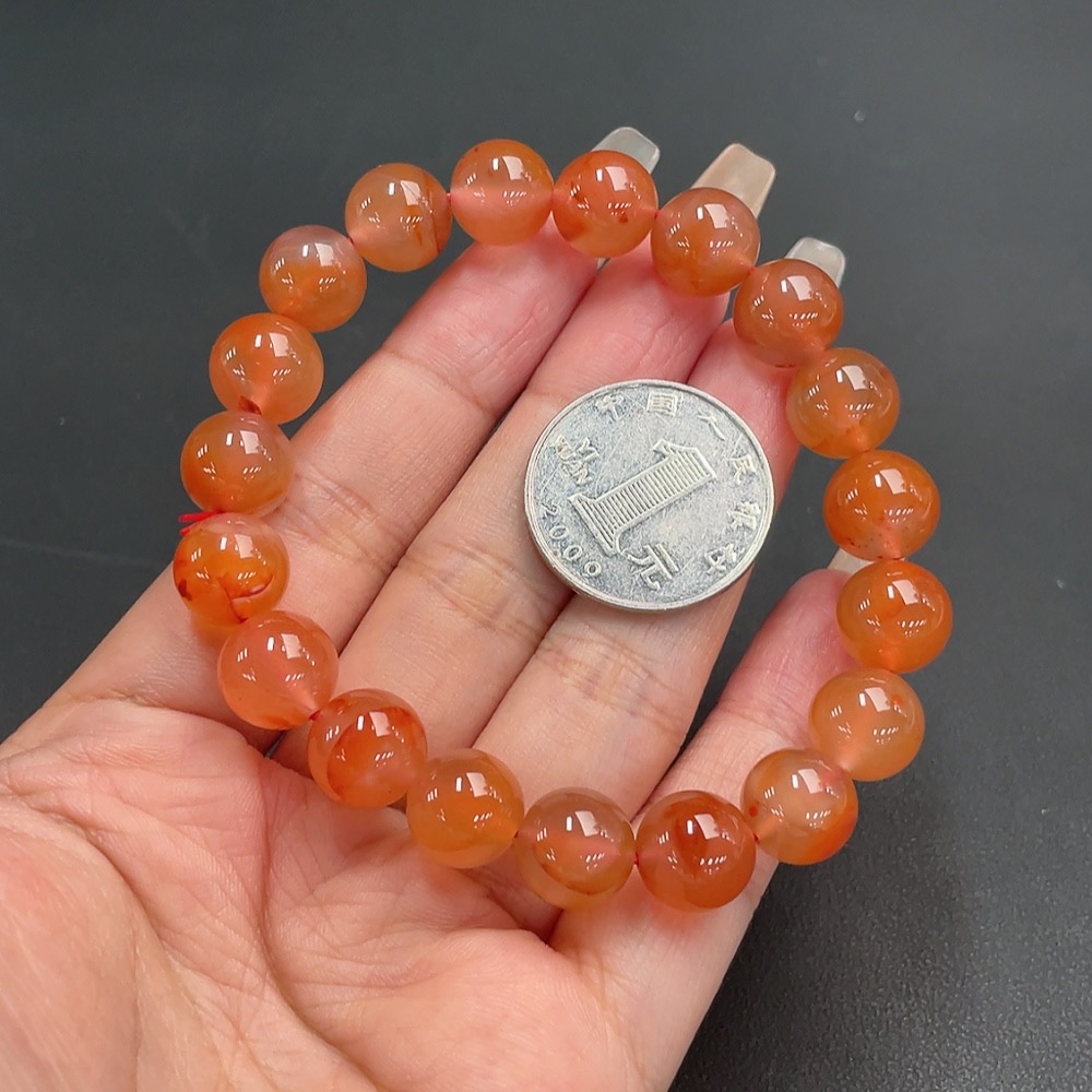 C21311547 South Red Agate Bracelet, approx. 11mm beads, total weight about 36.06g, organic matter visible