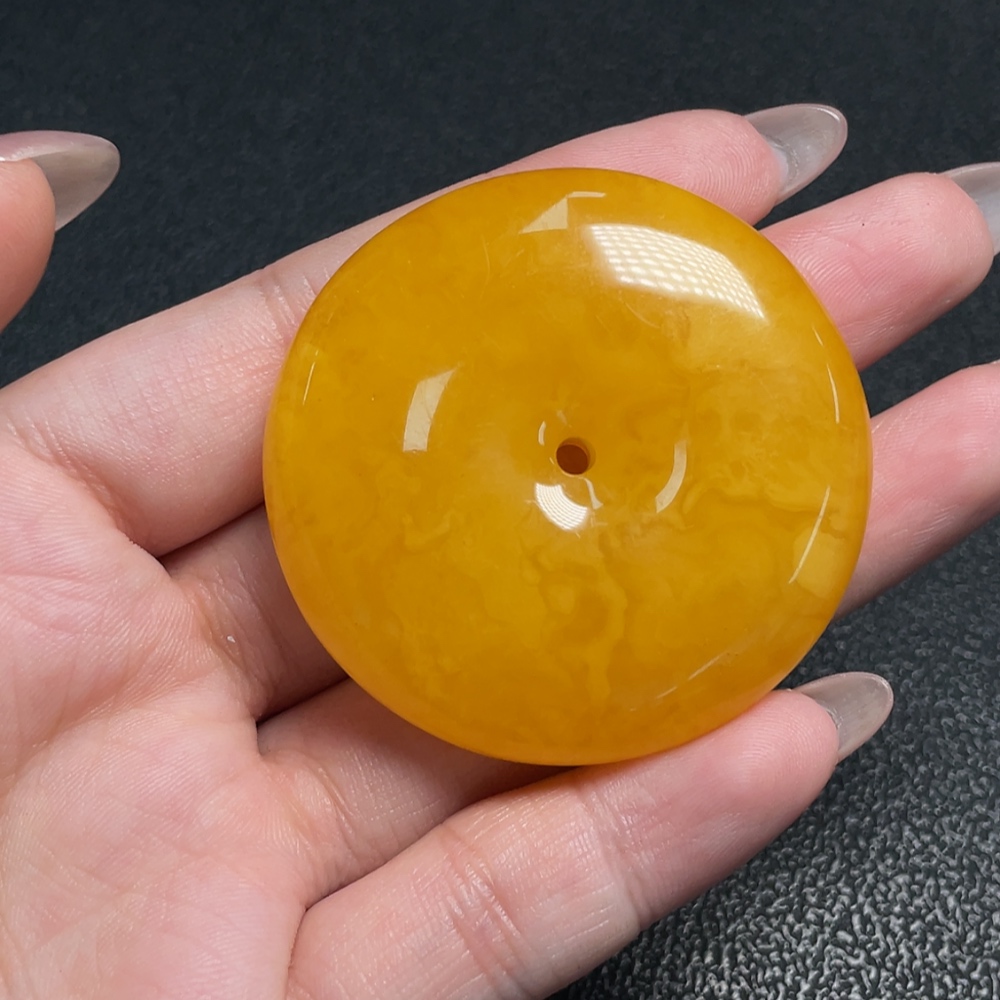 C34009607 Amber Beeswax Pendant with a total weight of approximately 17.71 grams