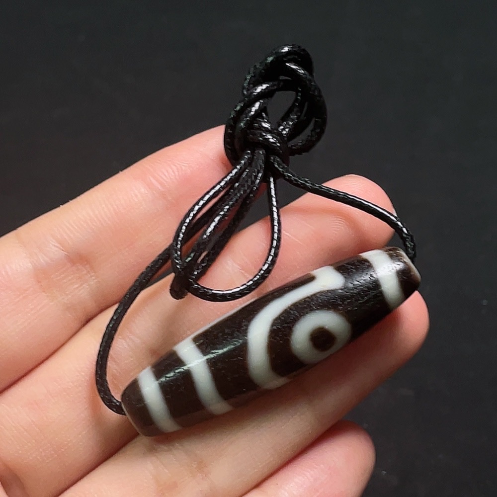 W32764439 Dzi bead pendant, total weight including cord approximately 12.94g, size about 47.2mm