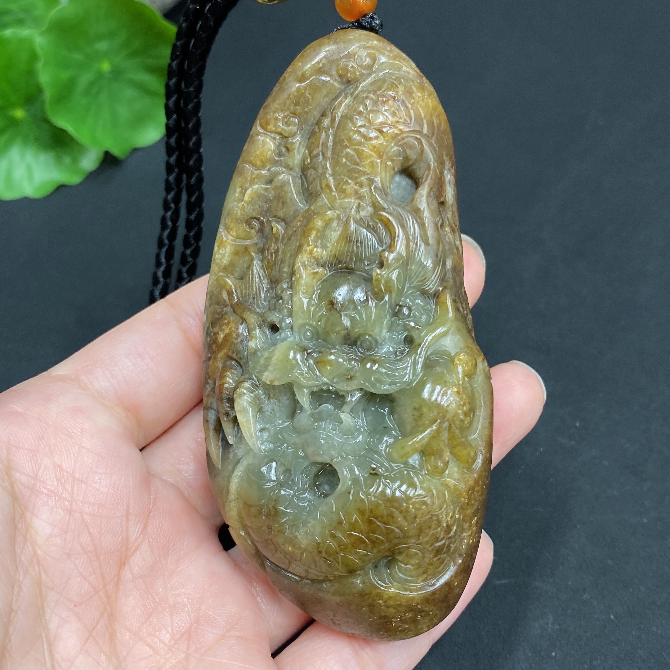 H22439310 Hetian Jade Pendant  Dragon  Total Weight (including rope) 139.7g  Undetermined skin color origin  Contains other natural mineral components