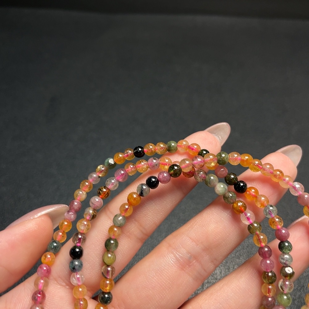C34008843 Tourmaline bead strand with other mineral components, visible organic matter, total weight approx. 17.98g, size approx. 3.9mm