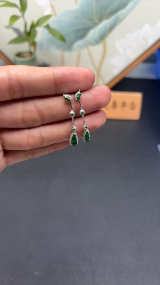 F34982006 Jadeite earrings set in 18K gold with diamonds, total weight approximately 2 grams per pair