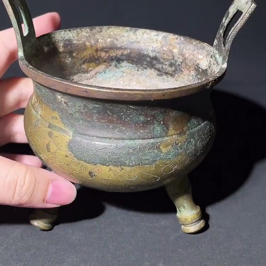 W28238912 Miscellaneous Late Qing and Republic Period Three-legged Double-handled Copper Incense Burner with Floral Engravings