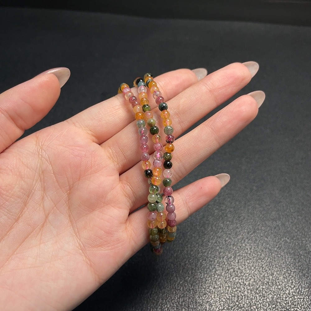 C34008843 Tourmaline bead strand with other mineral components, visible organic matter, total weight approx. 17.98g, size approx. 3.9mm