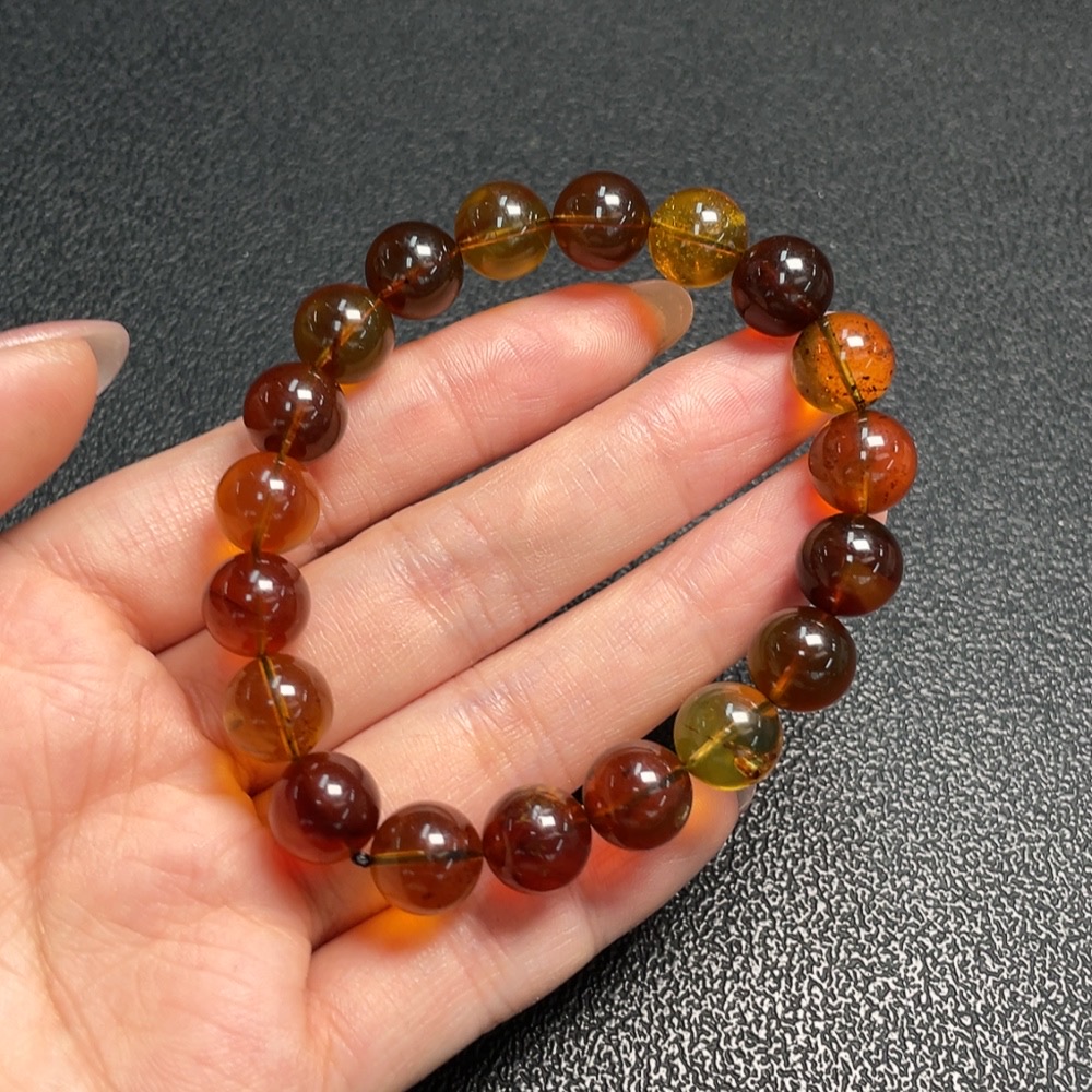 C29403695 Amber Beeswax Bracelet, approx. 9.9mm, total weight approx. 10.53g