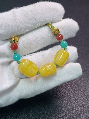 C34990683 Amber beeswax pendant with non-natural decorative stones, total weight approx. 7.47g (including cord), size approx. 11.4mm