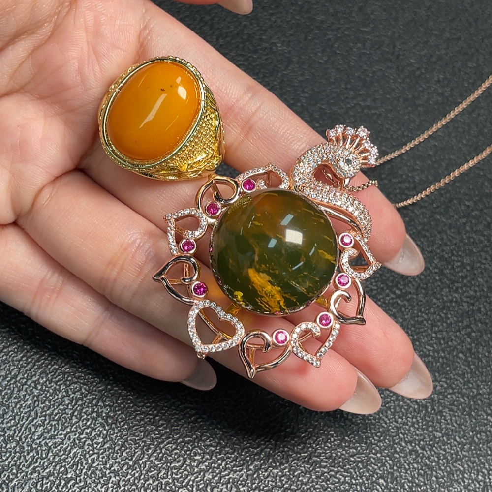 C34993222 Amber Beeswax Pendant + Ring Adjustable Non-Gold Total Weight Approx. 30.75g Sell as a Lot
