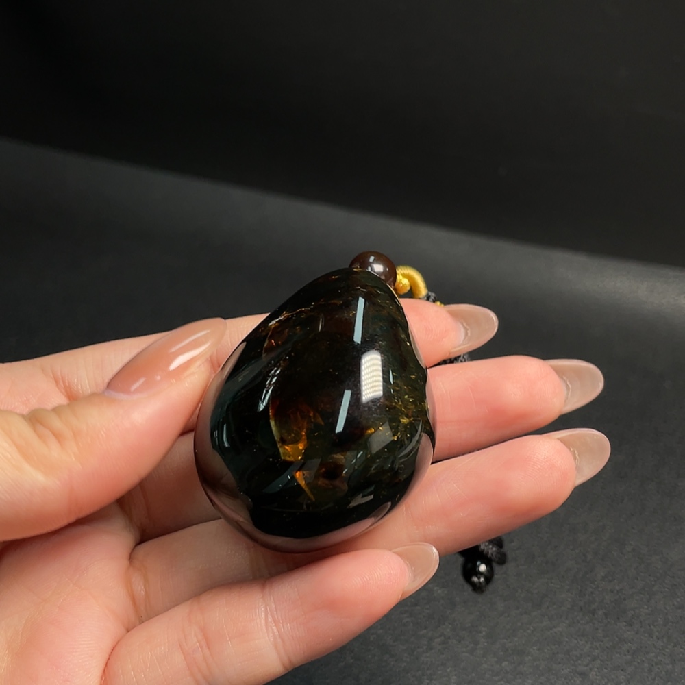 C31619792 Amber and Beeswax Pendant, Total Weight Approx. 27.15g Including Rope