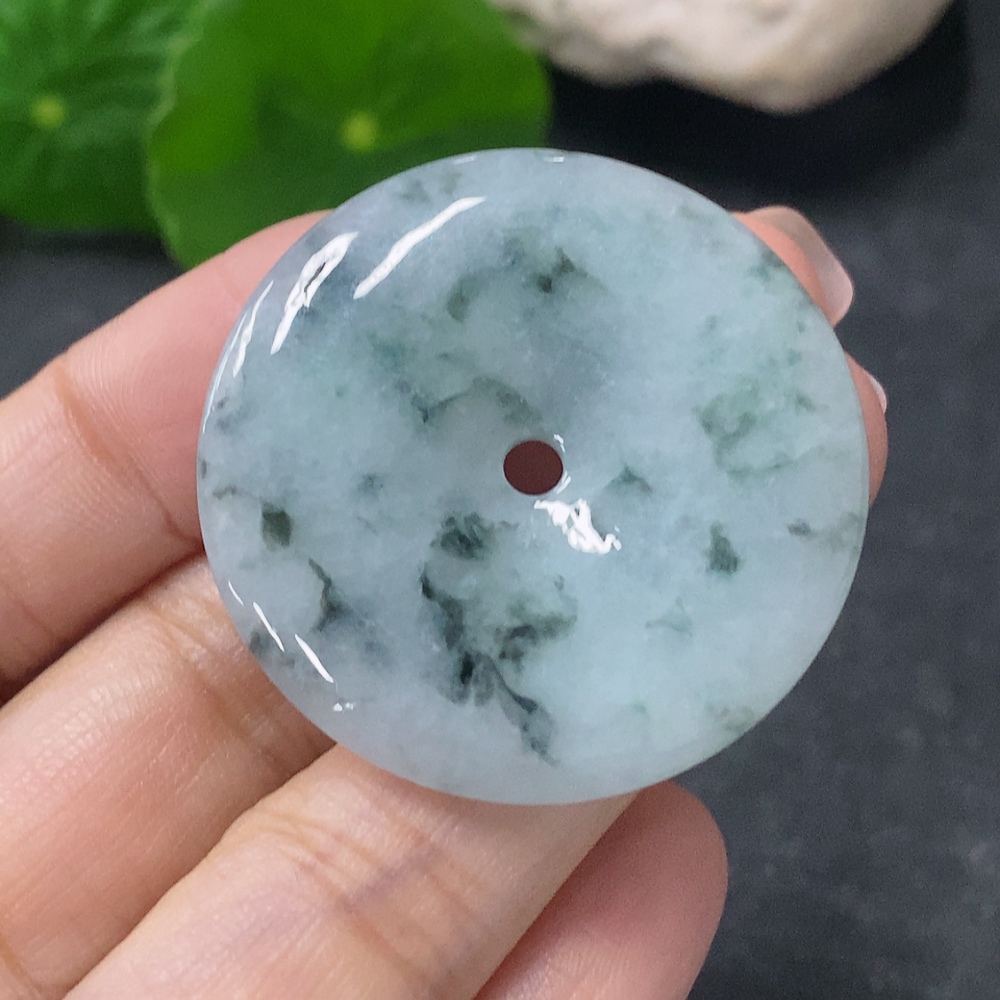 F34041946 Jadeite Pendant Peace Knot with an approximate total weight of 12.36g and containing other mineral components