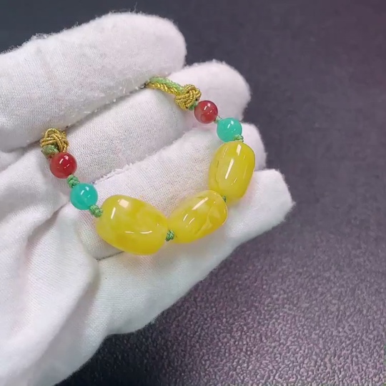 C34990683 Amber beeswax pendant with non-natural decorative stones, total weight approx. 7.47g (including cord), size approx. 11.4mm