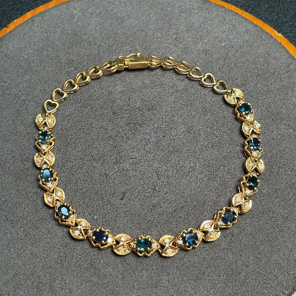 C33922202 Sapphire bracelet, color origin undetermined, accented with diamonds, no imprint, surface gold content approximately 75%, total item weight about 10.19 grams
