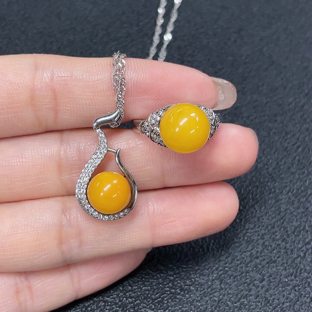 C29368481 Amber Beeswax Pendant + Ring Adjustable Non-Gold Total Weight Approx. 7.72g Sell as a Lot